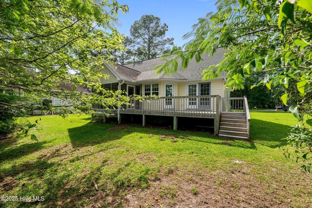 6112 Horton Rd, Oriental, NC 28571 - rear view of property featuring roof with shingles, a wooden deck, and a lawn