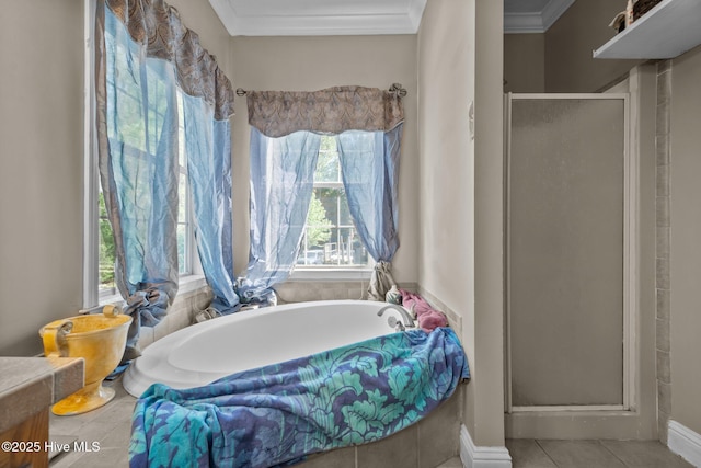 270 N Jenkins St, Holly Ridge, NC 28445 - bathroom with plenty of natural light, a stall shower, ornamental molding, a garden tub, and tile patterned floors