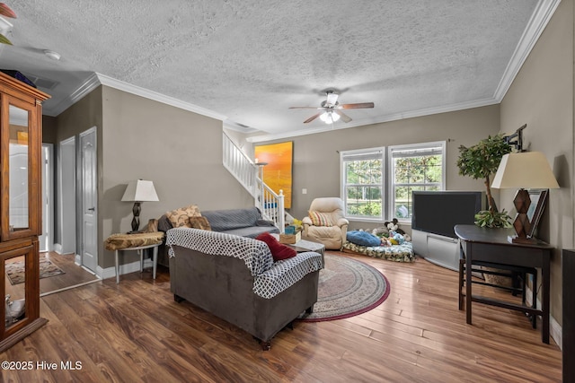 270 N Jenkins St, Holly Ridge, NC 28445 - living room featuring stairs, wood finished floors, a ceiling fan, ornamental molding, and a textured ceiling