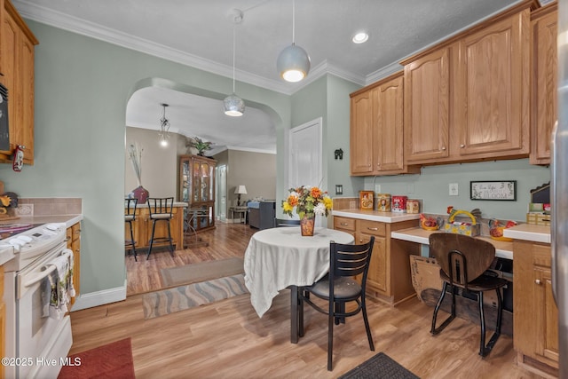 270 N Jenkins St, Holly Ridge, NC 28445 - kitchen with arched walkways, white electric stove, ornamental molding, light wood-type flooring, and light countertops