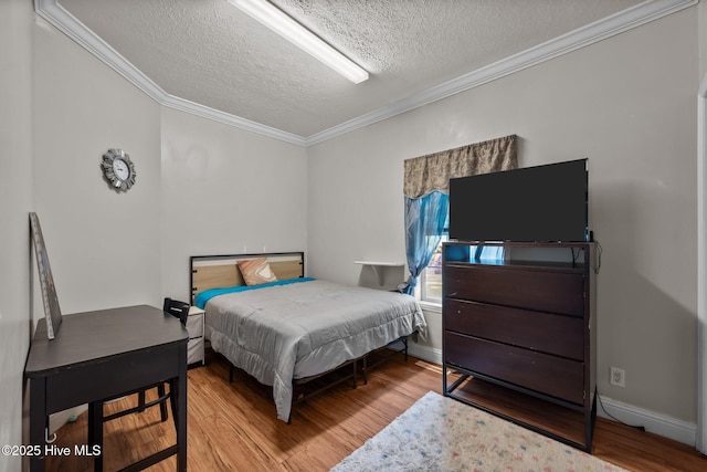 270 N Jenkins St, Holly Ridge, NC 28445 - bedroom with a textured ceiling, wood finished floors, ornamental molding, and baseboards