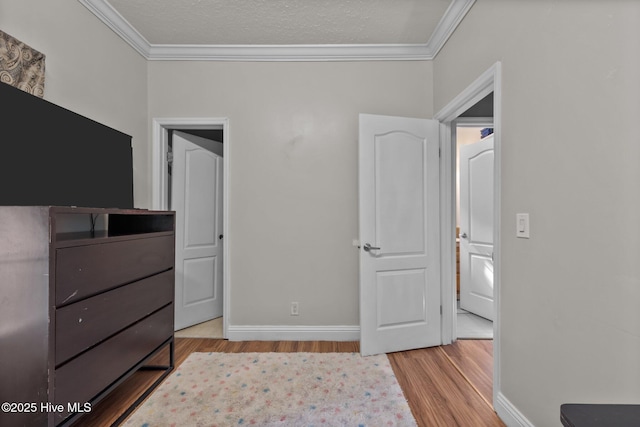 270 N Jenkins St, Holly Ridge, NC 28445 - bedroom featuring crown molding, wood finished floors, and baseboards