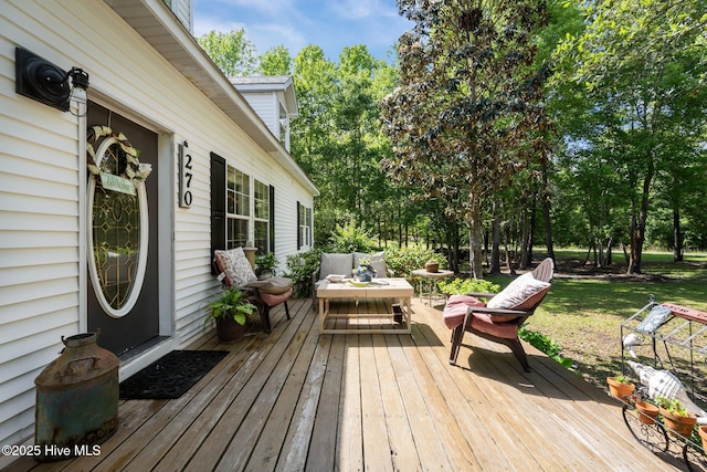 270 N Jenkins St, Holly Ridge, NC 28445 - wooden terrace featuring an outdoor hangout area and view of scattered trees