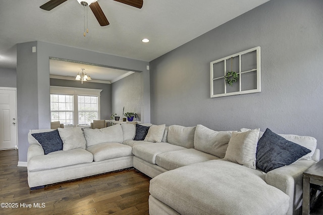 115 Elrod Rd, Moyock, NC 27958 - living room with dark wood-type flooring, crown molding, a ceiling fan, baseboards, and a chandelier
