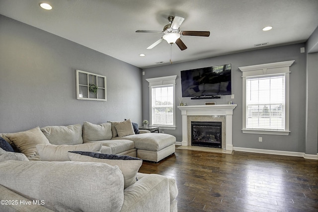 115 Elrod Rd, Moyock, NC 27958 - living area featuring a ceiling fan, a premium fireplace, dark wood finished floors, recessed lighting, and baseboards