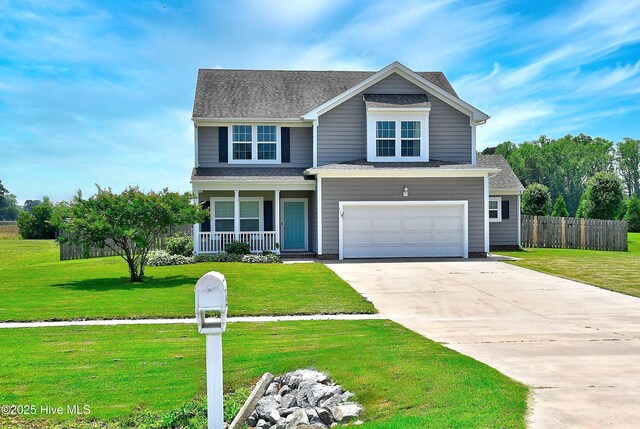 115 Elrod Rd, Moyock, NC 27958 - traditional-style house with covered porch, concrete driveway, a garage, and a shingled roof