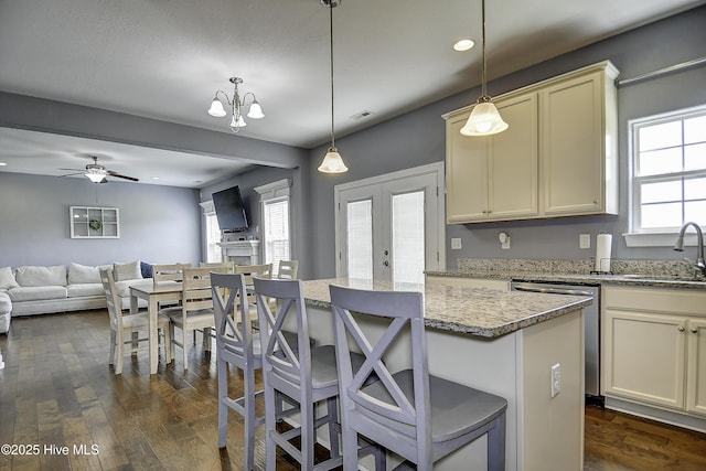 115 Elrod Rd, Moyock, NC 27958 - kitchen featuring a sink, open floor plan, stainless steel dishwasher, dark wood-style flooring, and a center island
