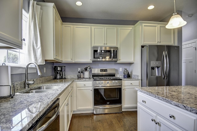 115 Elrod Rd, Moyock, NC 27958 - kitchen with appliances with stainless steel finishes, a sink, recessed lighting, dark wood-style floors, and white cabinets