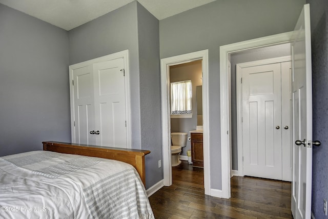 115 Elrod Rd, Moyock, NC 27958 - bedroom with hardwood / wood-style flooring, baseboards, and ensuite bathroom