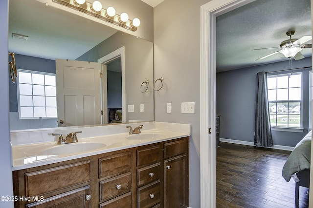115 Elrod Rd, Moyock, NC 27958 - bathroom featuring connected bathroom, plenty of natural light, and hardwood / wood-style floors