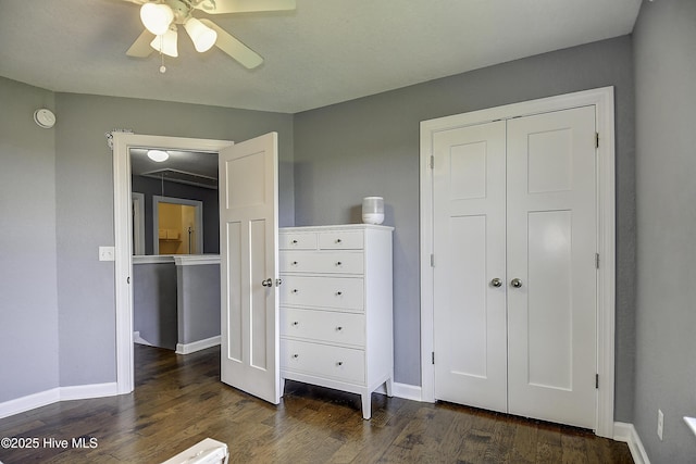115 Elrod Rd, Moyock, NC 27958 - bedroom with dark wood finished floors, baseboards, a closet, and a ceiling fan