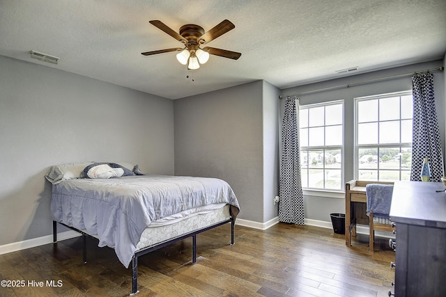 115 Elrod Rd, Moyock, NC 27958 - bedroom with hardwood / wood-style flooring, baseboards, a textured ceiling, and a desk