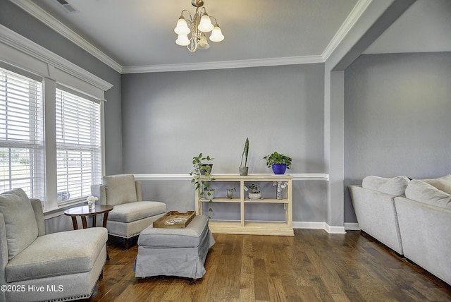115 Elrod Rd, Moyock, NC 27958 - sitting room with a chandelier, wood finished floors, baseboards, and crown molding