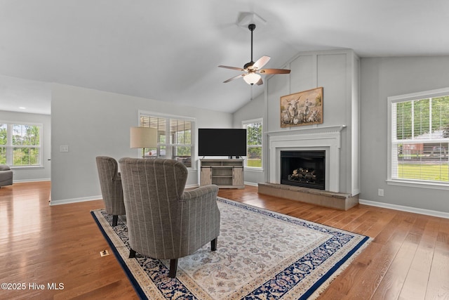 1139 Cranes Creek Rd, Cameron, NC 28326 - living area featuring a ceiling fan, healthy amount of natural light, lofted ceiling, wood finished floors, and a tiled fireplace