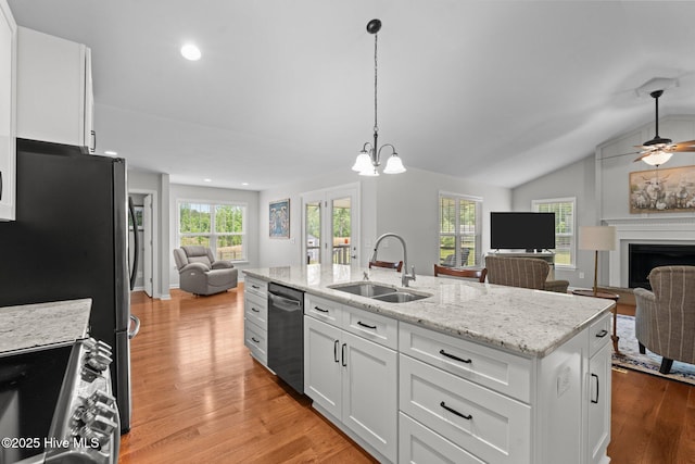 1139 Cranes Creek Rd, Cameron, NC 28326 - kitchen with open floor plan, stainless steel appliances, a sink, light wood-type flooring, and white cabinets