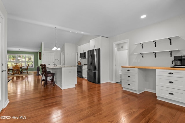 1139 Cranes Creek Rd, Cameron, NC 28326 - kitchen with freestanding refrigerator, range with electric cooktop, lofted ceiling, open shelves, and wood counters