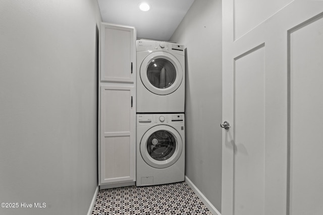 1139 Cranes Creek Rd, Cameron, NC 28326 - washroom with stacked washer and clothes dryer, cabinet space, baseboards, and light flooring