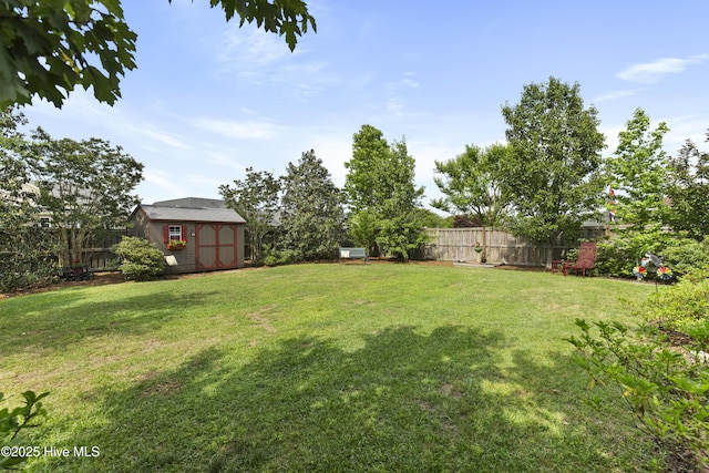 view of yard featuring a storage shed and an outdoor structure