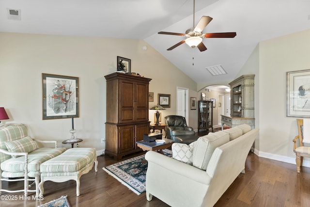 living area featuring arched walkways, ceiling fan, dark wood-style floors, baseboards, and high vaulted ceiling