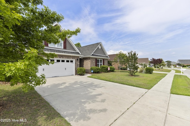 view of front facade with concrete driveway, brick siding, a front yard, and a garage