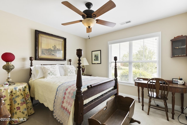 bedroom featuring baseboards, light carpet, and a ceiling fan