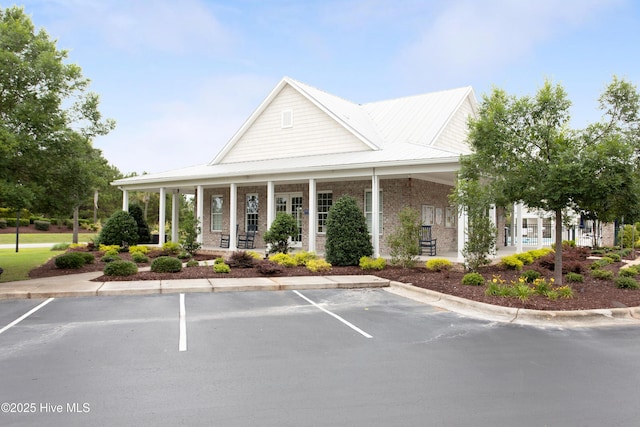view of building exterior with uncovered parking