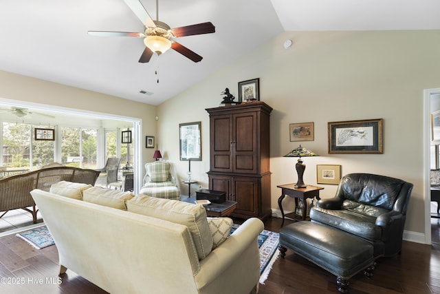 living area featuring ceiling fan, dark wood finished floors, high vaulted ceiling, and baseboards