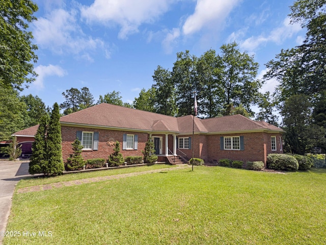 143 Rock Creek Dr, New Bern, NC 28562 - single story home with brick siding and a front lawn