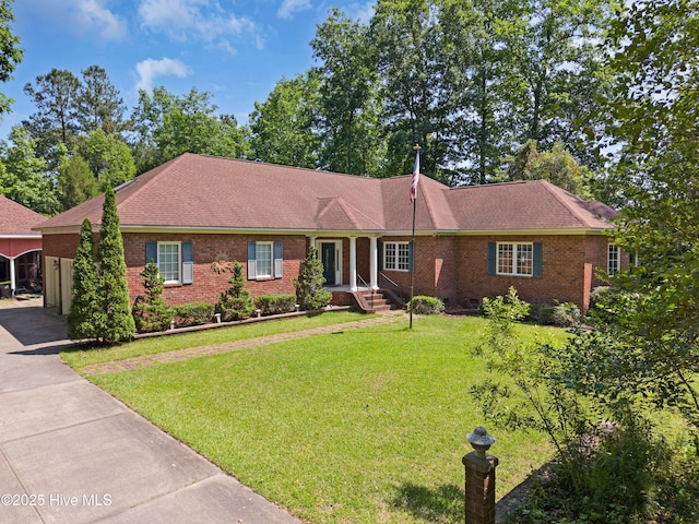 143 Rock Creek Dr, New Bern, NC 28562 - ranch-style house featuring brick siding, a front yard, driveway, and roof with shingles