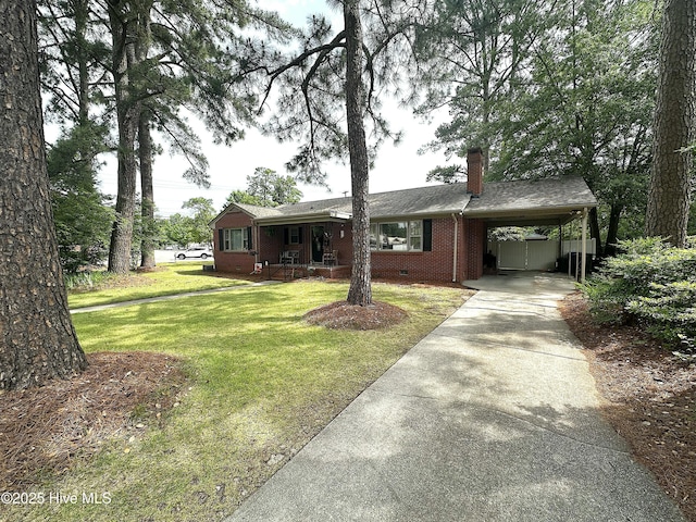 ranch-style house featuring concrete driveway, a chimney, a front yard, a porch, and an attached carport