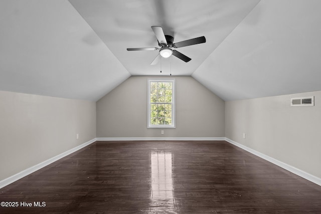 bonus room with ceiling fan, wood finished floors, vaulted ceiling, and baseboards