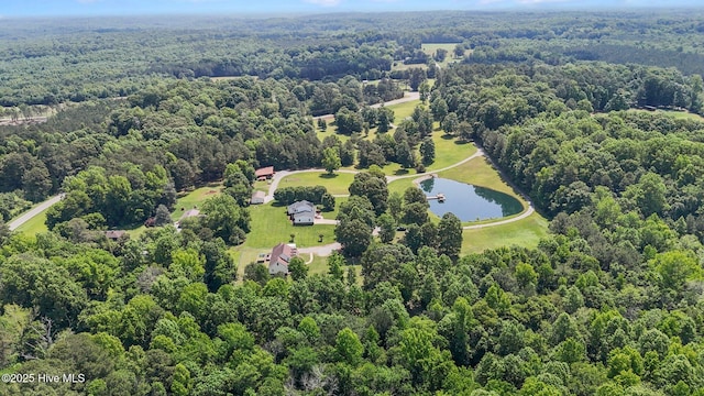bird's eye view of a large body of water and a heavily wooded area