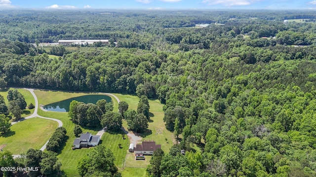 aerial view of a heavily wooded area and a nearby body of water