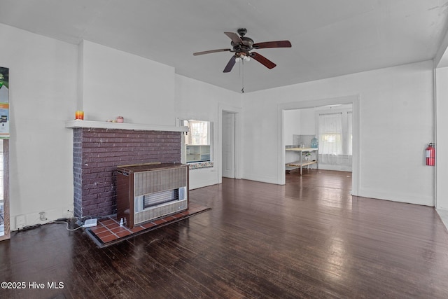 511 Herring Ave NE, Wilson, NC 27893 - living area featuring a fireplace, a ceiling fan, wood finished floors, and plenty of natural light