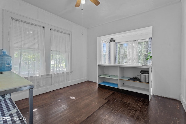 511 Herring Ave NE, Wilson, NC 27893 - unfurnished bedroom with wood-type flooring and ceiling fan
