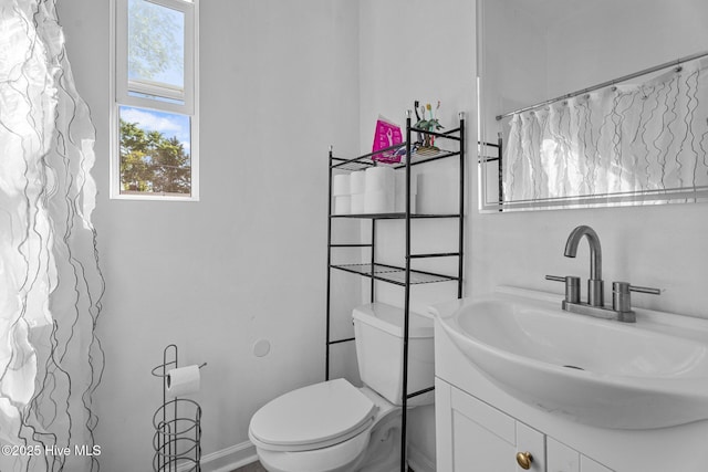 511 Herring Ave NE, Wilson, NC 27893 - bathroom with toilet and vanity