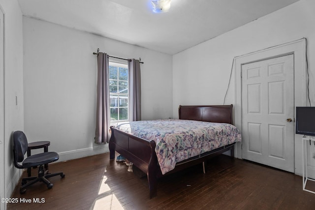 511 Herring Ave NE, Wilson, NC 27893 - bedroom featuring dark wood finished floors and baseboards