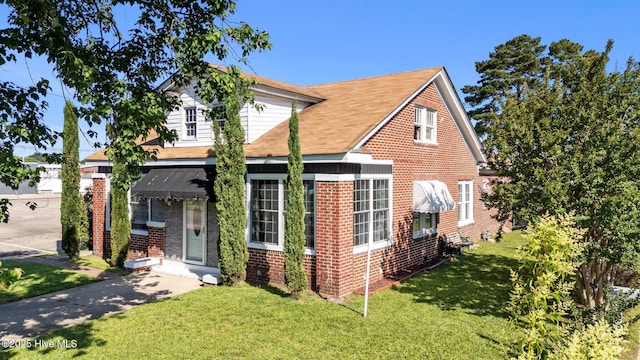 511 Herring Ave NE, Wilson, NC 27893 - view of front of property with brick siding and a front yard