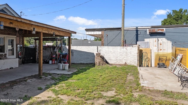 511 Herring Ave NE, Wilson, NC 27893 - fenced backyard featuring a patio area