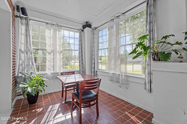 511 Herring Ave NE, Wilson, NC 27893 - sunroom featuring baseboards and tile patterned floors