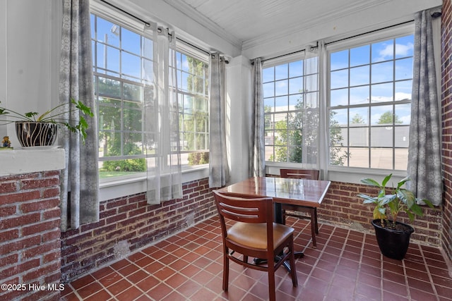 511 Herring Ave NE, Wilson, NC 27893 - sunroom / solarium with brick wall, crown molding, and tile patterned floors