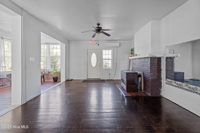 511 Herring Ave NE, Wilson, NC 27893 - entrance foyer with a wall mounted air conditioner, wood-type flooring, and a ceiling fan
