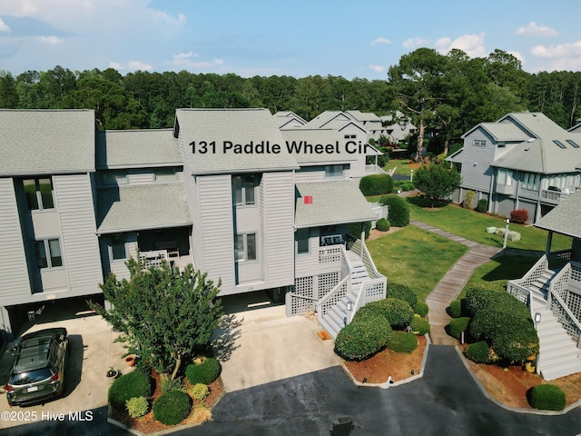 131 Paddle Wheel Cir, Washington, NC 27889 - view of property featuring stairs, asphalt driveway, and a residential view
