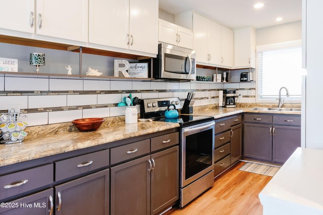 131 Paddle Wheel Cir, Washington, NC 27889 - kitchen featuring stainless steel appliances, open shelves, a sink, white cabinets, and recessed lighting