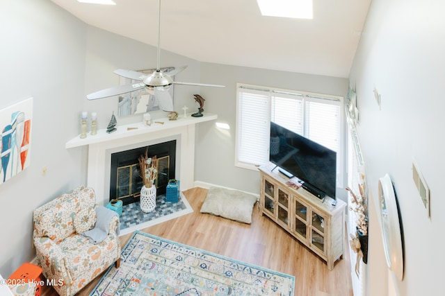 131 Paddle Wheel Cir, Washington, NC 27889 - living area with lofted ceiling, wood finished floors, a glass covered fireplace, and ceiling fan