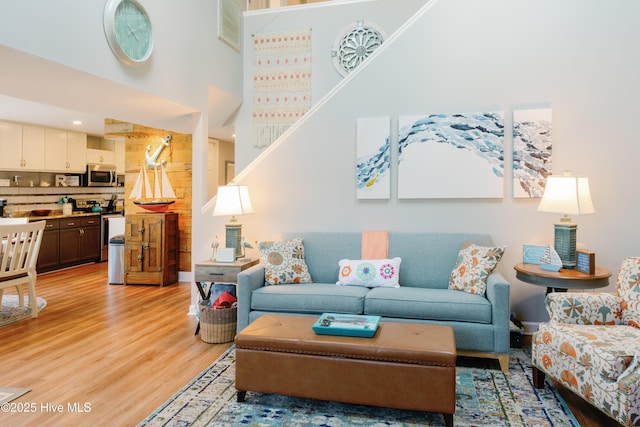131 Paddle Wheel Cir, Washington, NC 27889 - living room with light wood finished floors and a towering ceiling