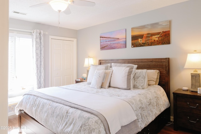 131 Paddle Wheel Cir, Washington, NC 27889 - bedroom featuring dark wood-type flooring, a closet, a ceiling fan, and baseboards