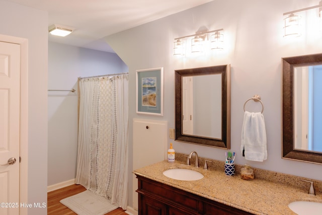 131 Paddle Wheel Cir, Washington, NC 27889 - bathroom featuring double vanity, wood finished floors, and curtained shower