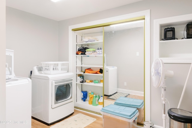 131 Paddle Wheel Cir, Washington, NC 27889 - clothes washing area with independent washer and dryer and wood finished floors