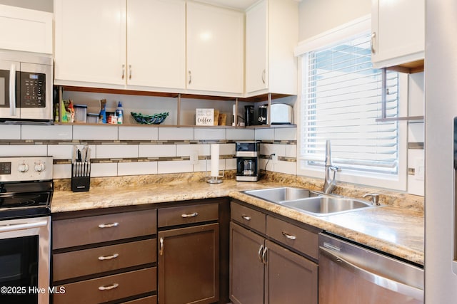 131 Paddle Wheel Cir, Washington, NC 27889 - kitchen with appliances with stainless steel finishes, a sink, light countertops, white cabinetry, and open shelves